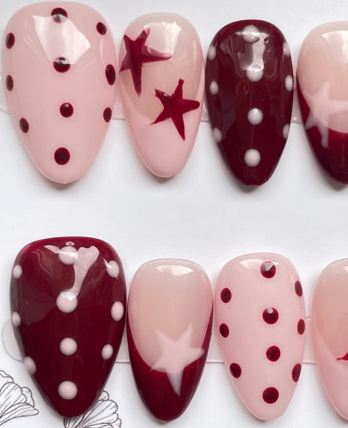 Burgundy pink spots and stars