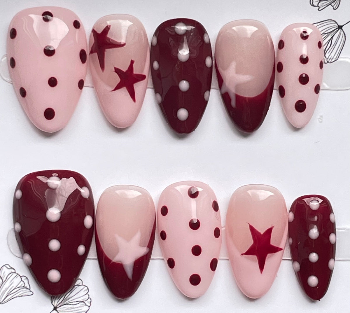 Burgundy pink spots and stars