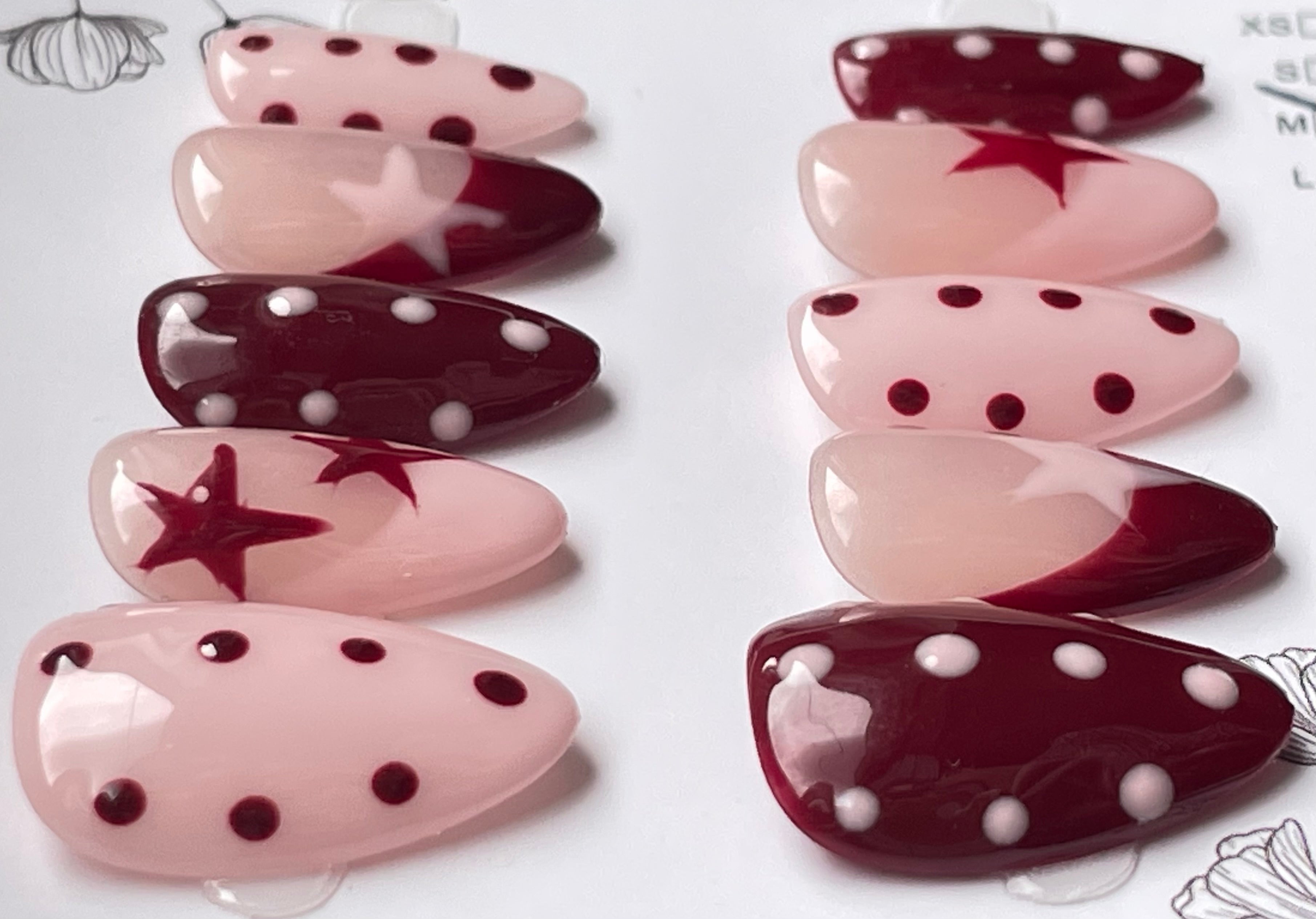 Burgundy pink spots and stars